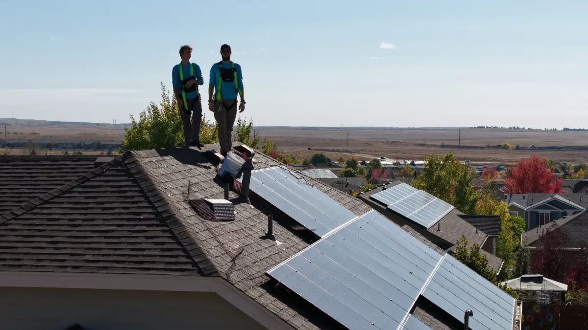 Solar panel repair work on a residential roof.